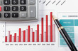 pen showing diagram on financial report