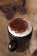 hot frothy drink cappuccino chokolate dusted, black paper butter hot frothy drink cappuccino chokolate dusted, black paper butter
