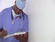 Surgeon making notes