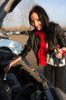 Woman repairing the car