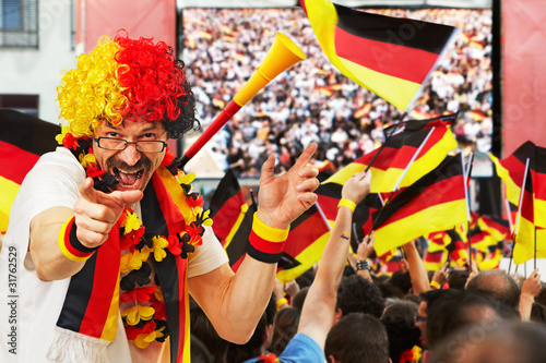 Foto: german soccer fan at open air live broadcast german soccer fan at open air live broadcast