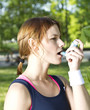 Young girl with asthma inhalator