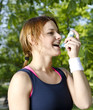 Young girl with asthma inhalator