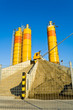 Yellow concrete silos over blue sky