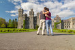 Photo: Couple in hug looking to the idyllic Ashford castle Couple in hug looking to the idyllic Ashford castle