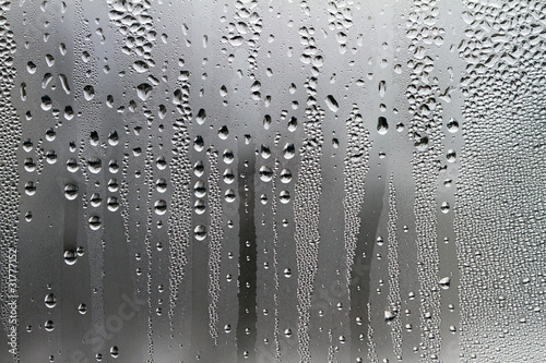 Photo: Water droplets on a glass surface Water droplets on a glass surface