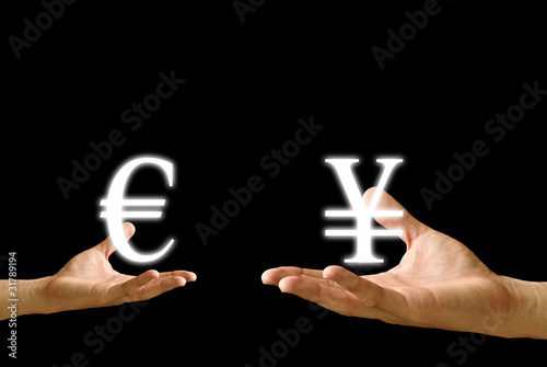 Photo: Small hand exchange Euro icon withYen icon, Concept Small hand exchange Euro icon withYen icon, Concept