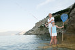 Fishing - little girl with mother fishing at the beach