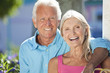 Happy Senior Couple Smiling Outside in Sunshine