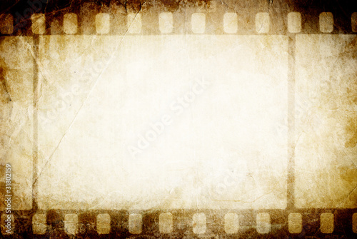Photo: Old filmstrip. Classic vintage background. Old filmstrip. Classic vintage background.