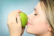 Photo: woman eat green apple woman eat green apple