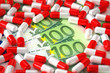 Expensive medication concept with Euro bills and capsules