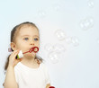 The girl starting up soap bubbles