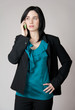 Worried business woman talking on the cell phone