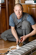 technician prepares a new air conditioner to be installed