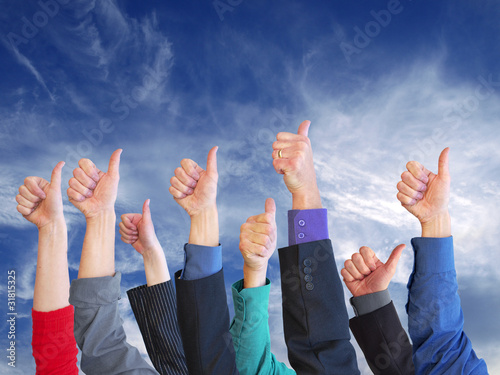 Photo: Business thumbs skyward Business thumbs skyward