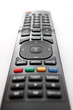 The remote control unit. Focus on button "OK"