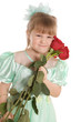 The little girl with a bouquet of roses