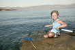 Fishing -  girl fishing at the beach