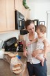 A Mother Making A Sandwich For His Baby Girl