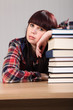 ����: Tired student girl resting on stack of books � Darrin Henry #31828120