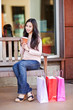 Shopping woman drinking coffee
