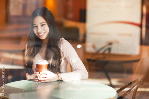 Photo: Woman drinking coffee Woman drinking coffee