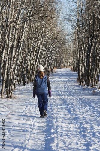 Photo: Woman Walking On Pathway In The Winter Woman Walking On Pathway In The Winter