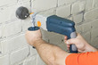 House-builder working with a perforator