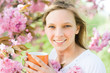 Young woman with cup tea