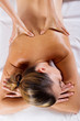 Foto: young woman receiving back massage young woman receiving back massage