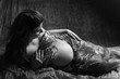 Beautiful Pregnant woman laying on the floor