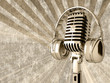 Microphone with headphones on the old background