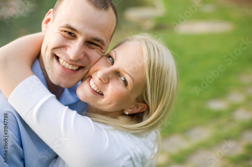 Photo: Closeup portrait of attractive young couple. Closeup portrait of attractive young couple.