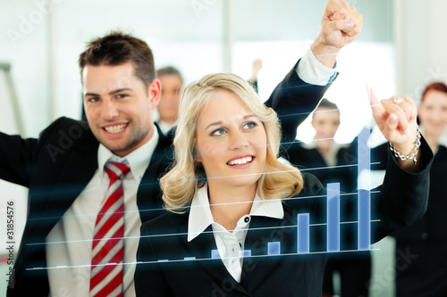 Photo: Business - presentation of chart in team Business - presentation of chart in team