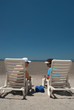 A couple enjoys their conversation at the beach