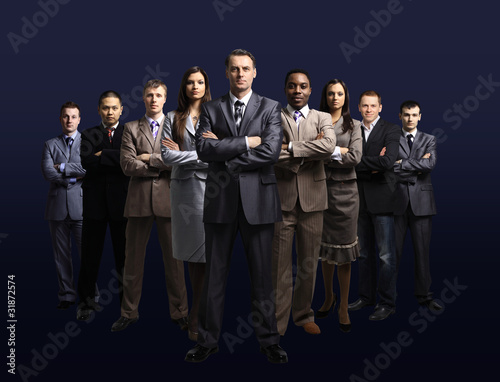 Photo: business team formed of young businessmen standing business team formed of young businessmen standing