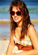 Photo: Pretty girl with red sunglasses on the beach Pretty girl with red sunglasses on the beach