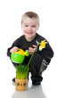 Cute little boy watering the flower Cute little boy watering the flower