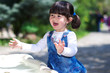Small girl playing with water and laughing Small girl playing with water and laughing
