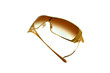 A pair of very stylish gold sunglasses A pair of very stylish gold sunglasses