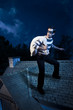 Photo: Thief walking on the roof of a house at night Thief walking on the roof of a house at night