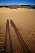 Pair of shadows on a dune in Africa Pair of shadows on a dune in Africa
