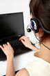 operator with headset and a notebook