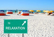 To relaxation sign pointing to beach