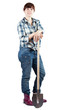 young  woman stands with spade