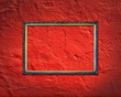 vintage red terracotta interior with empty classic frame hanging