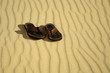 Pair of flip flops on beach sand Pair of flip flops on beach sand
