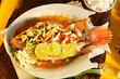 Thai food - Red snapper with garlic, chili, lemon grass and lemo Thai food - Red snapper with garlic, chili, lemon grass and lemo
