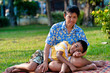 Foto: Mother and son play in a park Mother and son play in a park